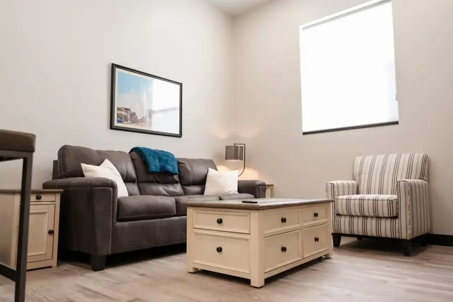 Loft living room with sofa and armchair
