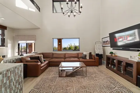 Bright living room with high ceilings and comfortable sofa