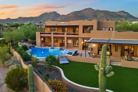 Resort-style pool area framed by the mountains