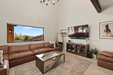 Living room with large windows and desert views