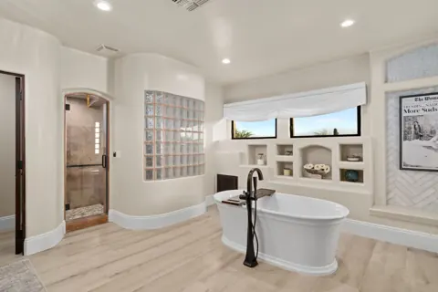 Soaking tub, shower and double vanities in the primary bathroom