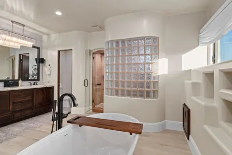 Bright bathroom with soaking tub and shower
