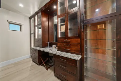 Dual vanity with rich wood cabinetry