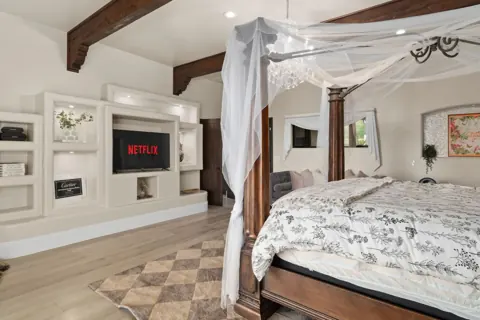 Primary suite with fireplace and lounge space
