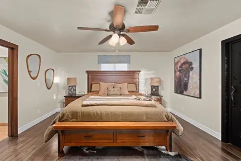 Comfortable guest bedroom with warm wood accents