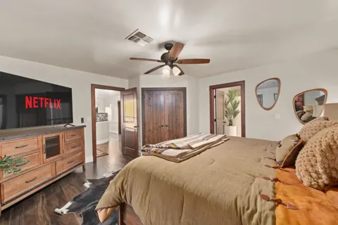 Comfortable guest bedroom with warm desert tones