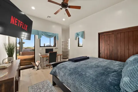Guest room with TV and relaxed seating