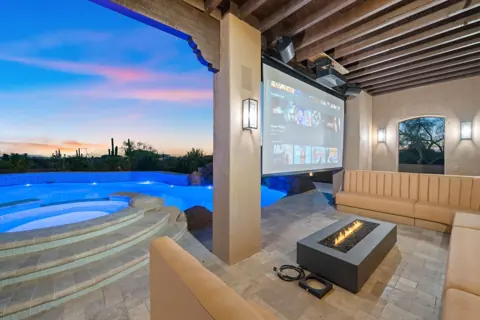 Outdoor entertainment area with pool views