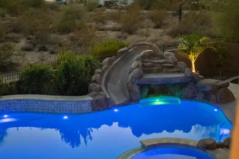 Water feature and spa tucked into the landscape