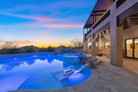 Pool and patio glowing at sunset