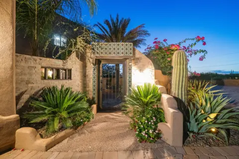 Welcoming front walkway with desert plants