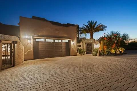 Grand front exterior with evening lighting