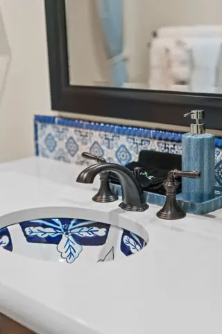 Bathroom sink with patterned tile