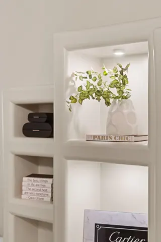 Bathroom shelves with decorative greenery