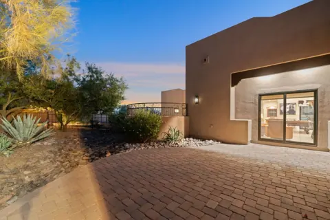 Private exterior walkway and desert landscaping