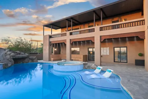 Outdoor lounge and pool with warm sunset light