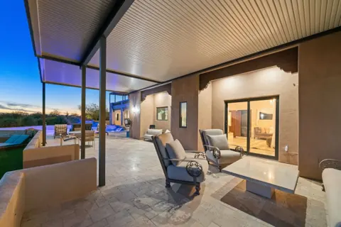 Outdoor lounge space with pool views