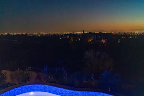 Desert skyline glowing after dark