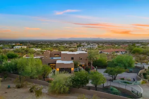 Aerial sunset view of the home’s desert setting
