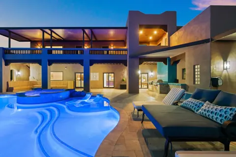 Glowing pool and patio at blue hour