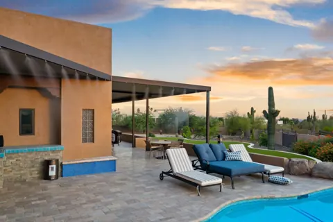 Lounge chairs beside the sparkling pool