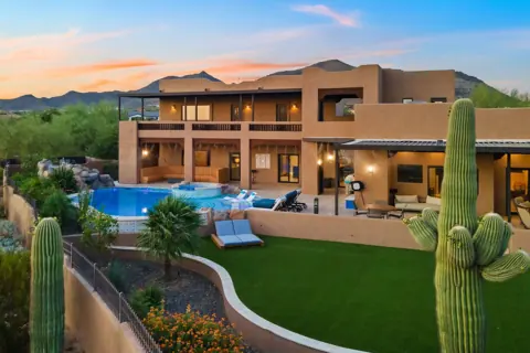 Backyard oasis with pool, spa, and mountain views